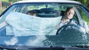 Woman with a map in car